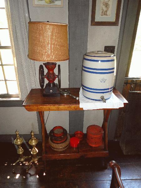 brass andirons, bucket bench and water cooler